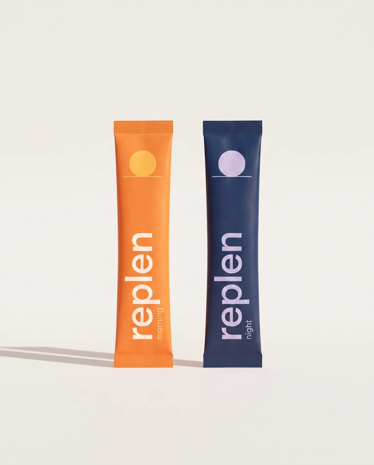 The morning and night sticks standing side by side on an off-white backdrop